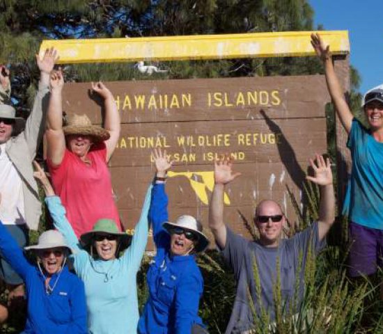 Millerbird team on Laysan Island. (back row/ left to right) Peter Luscomb, Dr. Thierry Work, Chris Farmer,Michele Kuter, Claudia Mischler, Tawn Speetjens, Amy Munes. (front row kneeling/left to right) Robby Kohley, Sheila Conant, Sheldon Plentovich