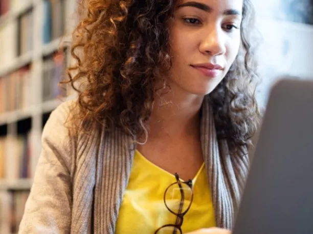 Young woman looking at laptop computer