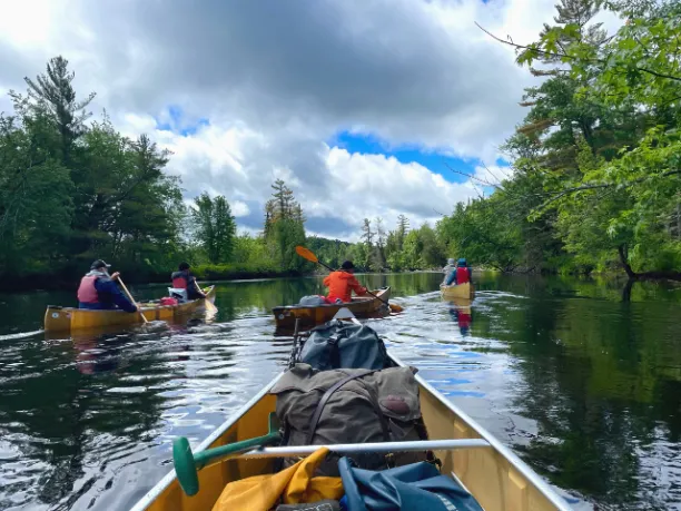 Canoe on the river with others