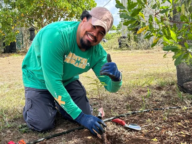 a Department of Defense employee participates in a volunteer planting project on National Public Lands Day