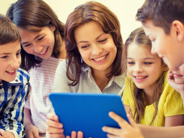 Teacher and students using a tablet