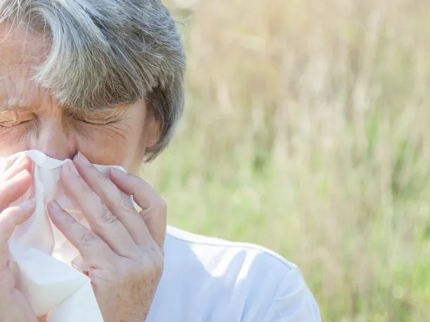 Mature woman using tissue