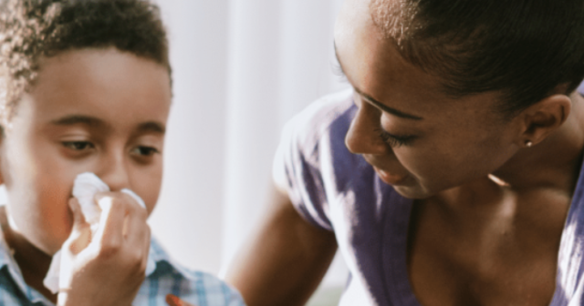 mother caring for son with stuffy nose