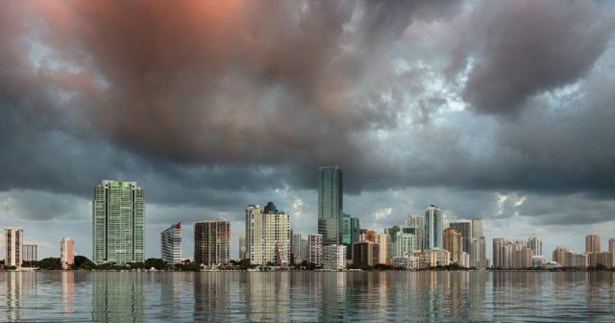 Photo of Miami at sunrise reflecting in the water, adapting to climate change