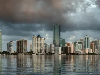 Dawn view of Miami Skyline reflected in water