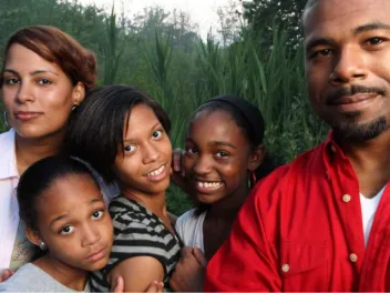 Father, mother, and three kids outdoors