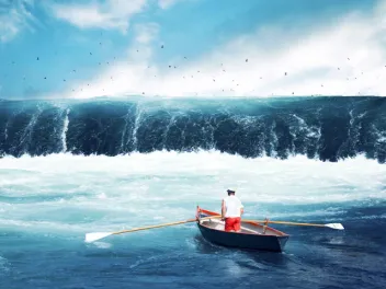 Man in small boat facing tsunami