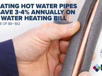 Close up of hand insulating a hot water pipe