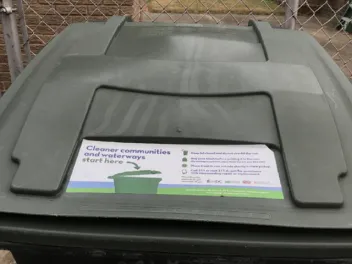 Top of garbage can with sticker