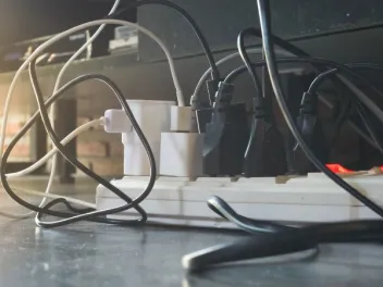 an electrical outlet power cord full with plugs