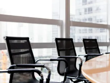 chairs around a table in a board room