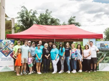 a group of officials from Toyota, NEEF and Park Along the River stand together at the Parkapalooza event in New Albany, MS