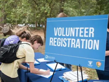 a volunteer registers for an outdoor volunteering event