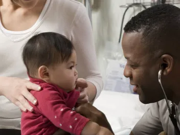 Health care professional with child and her mother