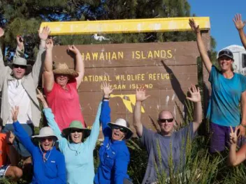 Millerbird team on Laysan Island. (back row/ left to right) Peter Luscomb, Dr. Thierry Work, Chris Farmer,Michele Kuter, Claudia Mischler, Tawn Speetjens, Amy Munes. (front row kneeling/left to right) Robby Kohley, Sheila Conant, Sheldon Plentovich