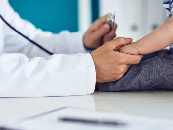 Doctor discussing lead poisoning with a child