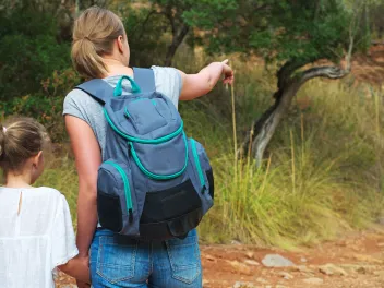 Woman showing her daughter animals in safari park