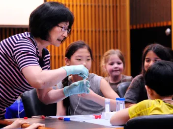 Huei Chen teaching children