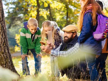 Teacher with kids at an outdoor classroom