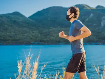 Man running with a mask on