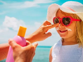 Child using sunblock