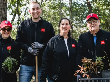 Family volunteering for NPLD event planting shrubs