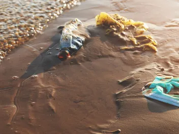 banner with masks on the beach