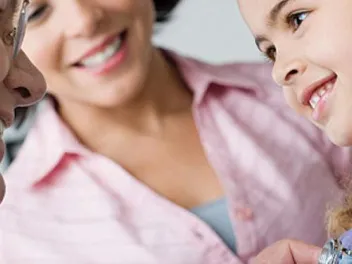 Pediatrician and young patient with parent