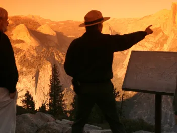 Park ranger explaining landscape to visitors