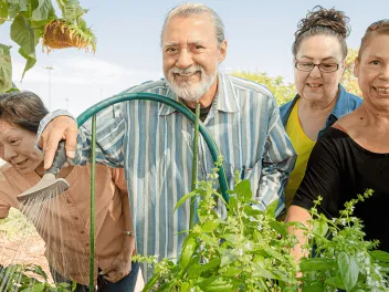 group of seniors working in community garden